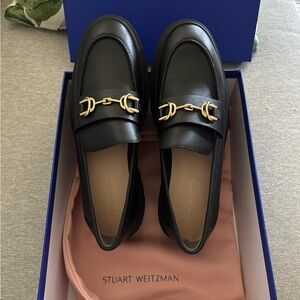 Stuart Weitzman Black Loafers with Gold Buckles